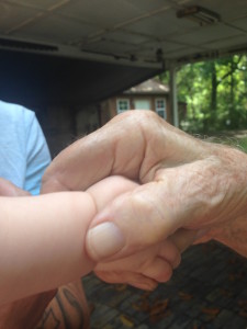 Grandpa holding hand with ramey