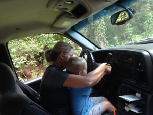Ramey, the grandson helping drive the work truck.